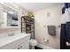 Well-lit bathroom with a white vanity, shelving, and coordinated towel accents at 311 Garvin St # 301B, Punta Gorda, FL 33950