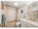 Bathroom with tub, sink, and coastal decor accents at 311 Garvin St # 301B, Punta Gorda, FL 33950
