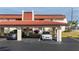 Assigned carport parking with tiled roof offering shade and protection for two vehicles near a condo unit at 311 Garvin St # 301B, Punta Gorda, FL 33950