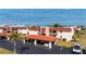 Exterior view of condos and carports with red tile roof at 311 Garvin St # 301B, Punta Gorda, FL 33950