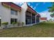 Well-maintained condo featuring screened lanais, lush lawn, and beautiful landscaping, perfect for outdoor living at 311 Garvin St # 301B, Punta Gorda, FL 33950