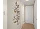 Hallway features a decorative wall sculpture and closet, leading to other areas of the home at 311 Garvin St # 301B, Punta Gorda, FL 33950