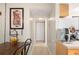 Hallway with tile floors, artwork, and leading to the dining area and other spaces at 311 Garvin St # 301B, Punta Gorda, FL 33950