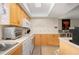 Kitchen with a full suite of appliances, abundant counter space, and bar seating area at 311 Garvin St # 301B, Punta Gorda, FL 33950