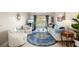 Bright living room with sliding glass doors, comfortable seating, stylish decor and tile flooring at 311 Garvin St # 301B, Punta Gorda, FL 33950