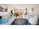 Open-concept living room with stylish decor, a dining area, and a glimpse of the kitchen at 311 Garvin St # 301B, Punta Gorda, FL 33950