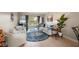 Bright living room with sliding glass doors, comfortable seating, stylish decor and tile flooring at 311 Garvin St # 301B, Punta Gorda, FL 33950