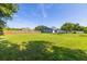 Large backyard featuring a well-maintained lawn and a wooden privacy fence at 3270 Ithaca St, Port Charlotte, FL 33952