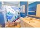 Bathroom with blue walls, shower and vanity at 3270 Ithaca St, Port Charlotte, FL 33952