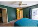 Bedroom featuring green walls, a closet, and a sliding glass door with access to the outdoors at 3270 Ithaca St, Port Charlotte, FL 33952
