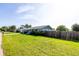 Charming single-story home with a well-maintained lawn and a wooden fence at 3270 Ithaca St, Port Charlotte, FL 33952