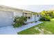 Well-maintained home with an attached garage, manicured landscaping and neutral toned exterior paint at 3270 Ithaca St, Port Charlotte, FL 33952