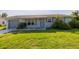 Charming single-story home with a well-kept lawn and an attached garage at 3270 Ithaca St, Port Charlotte, FL 33952
