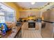 Kitchen featuring a window with stainless steel appliances and tile flooring at 3270 Ithaca St, Port Charlotte, FL 33952