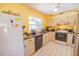 Cozy kitchen with stainless steel appliances, tile flooring, and wood cabinets at 3270 Ithaca St, Port Charlotte, FL 33952