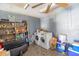 Laundry room featuring gray concrete walls, shelving units, and a washer and dryer at 3270 Ithaca St, Port Charlotte, FL 33952