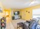 Cozy living room with entertainment center and tile flooring at 3270 Ithaca St, Port Charlotte, FL 33952