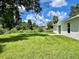 Expansive backyard with lush green grass, perfect for outdoor activities and relaxation at 3532 Richardson St, North Port, FL 34288