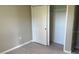 Bedroom showcasing wood-look floors and a closet with a white door and wire shelving at 3532 Richardson St, North Port, FL 34288