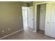 Neutral-toned bedroom featuring wood-look floors and a closet at 3532 Richardson St, North Port, FL 34288