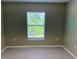 Empty bedroom with neutral walls, light wood-look flooring, and a window with natural light at 3532 Richardson St, North Port, FL 34288