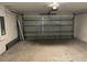Attached two car garage with metal roll-up door and automatic opener at 3532 Richardson St, North Port, FL 34288