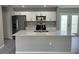 Well-equipped kitchen with stainless steel appliances, microwave above range, ample counter space, and a sizable center island at 3532 Richardson St, North Port, FL 34288