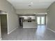 Bright, open kitchen with white cabinets, stainless steel appliances, and a breakfast bar at 3532 Richardson St, North Port, FL 34288