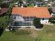 Inviting aerial view of a pool and backyard with lush green landscaping at 3588 Tripoli Blvd, Punta Gorda, FL 33950