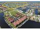 Expansive aerial view of waterfront homes, boat docks, and a well-maintained community at 3588 Tripoli Blvd, Punta Gorda, FL 33950