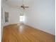 Spacious primary bedroom featuring hardwood floors, a ceiling fan and plenty of natural light at 3588 Tripoli Blvd, Punta Gorda, FL 33950