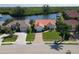 Charming waterfront home with red tile roof, brick driveway, and serene canal views at 3588 Tripoli Blvd, Punta Gorda, FL 33950