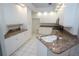 Well-equipped kitchen with white cabinets, stone countertops, and a stainless steel microwave at 3588 Tripoli Blvd, Punta Gorda, FL 33950