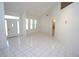 Bright and airy living room featuring tile flooring, high ceilings and plenty of natural light at 3588 Tripoli Blvd, Punta Gorda, FL 33950