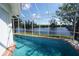 Enclosed pool area offering serene water views and a refreshing escape with privacy at 3588 Tripoli Blvd, Punta Gorda, FL 33950