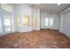 Bright sunroom featuring tile flooring, ceiling fans, and glass doors at 3588 Tripoli Blvd, Punta Gorda, FL 33950