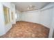 Large sunroom featuring tile floors, roller shades, and ceiling fans for added comfort at 3588 Tripoli Blvd, Punta Gorda, FL 33950