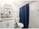 Well-lit bathroom featuring tiled shower with a granite countertop, a modern sink, and stylish fixtures at 3612 Patina Dr, Tampa, FL 33619