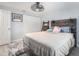 Charming bedroom with a modern twist, rustic headboard, soft rug, and ample closet space at 3612 Patina Dr, Tampa, FL 33619