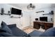 Cozy bedroom with sports theme, TV, wooden desk and shelves perfect for relaxing or gaming at 3612 Patina Dr, Tampa, FL 33619