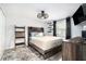 Serene bedroom with modern lighting, rustic wood accents, and a comfortable rug, a restful retreat at 3612 Patina Dr, Tampa, FL 33619
