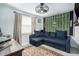 Comfortable room with blue couch and a fun Vikings theme perfect for relaxing or entertaining at 3612 Patina Dr, Tampa, FL 33619