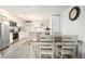 Modern kitchen with white cabinetry, stainless steel appliances, and an island counter for casual dining at 3612 Patina Dr, Tampa, FL 33619
