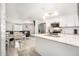 Bright, updated kitchen with white cabinets, stainless steel appliances, and an adjacent dining area at 3612 Patina Dr, Tampa, FL 33619