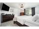 Bright main bedroom boasts wood furnishings, fan, neutral colors, and sliding glass door to the patio at 3612 Patina Dr, Tampa, FL 33619