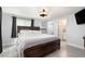 Spacious main bedroom with en suite bathroom and featuring modern ceiling fan and neutral color palette at 3612 Patina Dr, Tampa, FL 33619