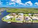 Expansive waterfront property boasts a private pool, dock, and stunning views of the surrounding waterways and lush greenery at 4142 Reif Ct, Port Charlotte, FL 33981