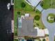 A beautiful waterfront home featuring a lush lawn, a pool, a private dock, and a shed at 4142 Reif Ct, Port Charlotte, FL 33981