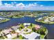Beautiful waterfront home on a canal with lush landscaping, and stunning water views at 4142 Reif Ct, Port Charlotte, FL 33981