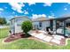 A serene backyard featuring a charming shed, lush lawn, and inviting patio space perfect for outdoor relaxation at 4142 Reif Ct, Port Charlotte, FL 33981
